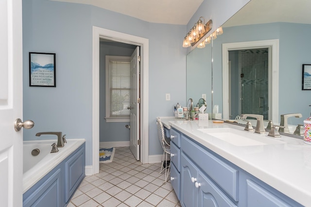 bathroom with a shower stall, vanity, tile patterned flooring, baseboards, and a bath