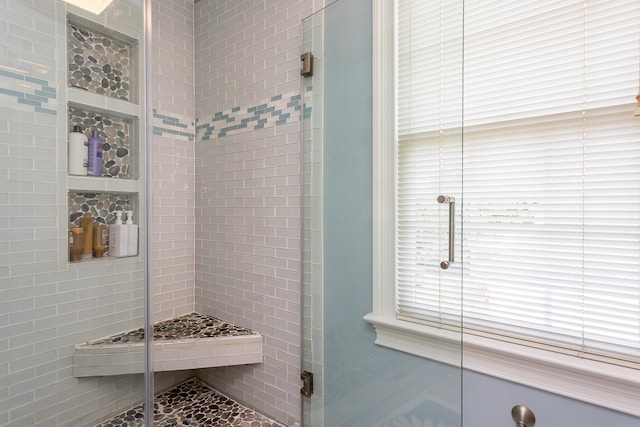 bathroom featuring a stall shower