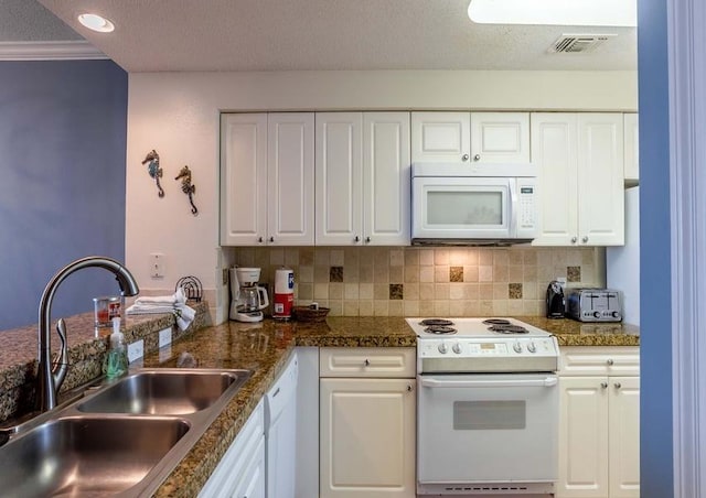 kitchen with white cabinetry, a textured ceiling, white appliances, and sink