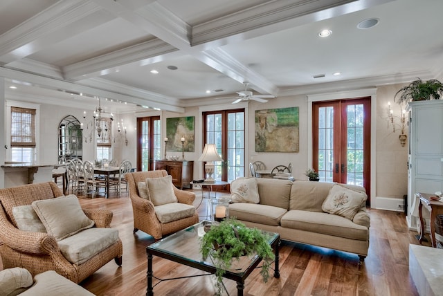 living room with wood-type flooring, french doors, ceiling fan, and crown molding