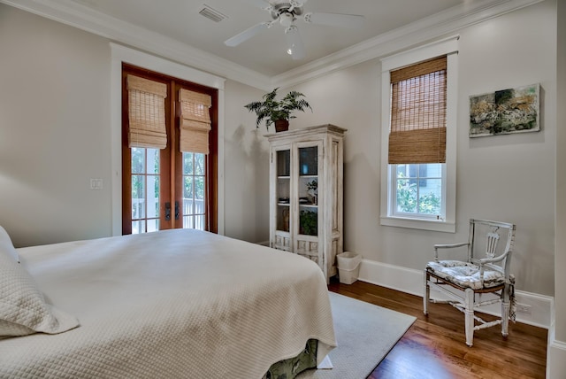 bedroom featuring ceiling fan, access to exterior, crown molding, french doors, and hardwood / wood-style flooring