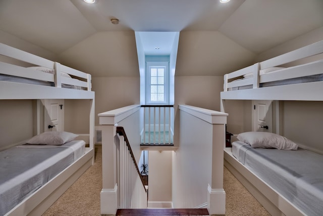 carpeted bedroom featuring vaulted ceiling