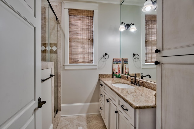 bathroom with crown molding, tile flooring, and large vanity