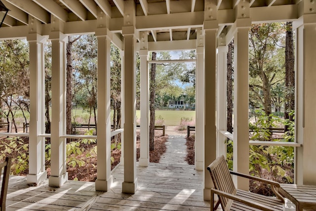 unfurnished sunroom with a wealth of natural light