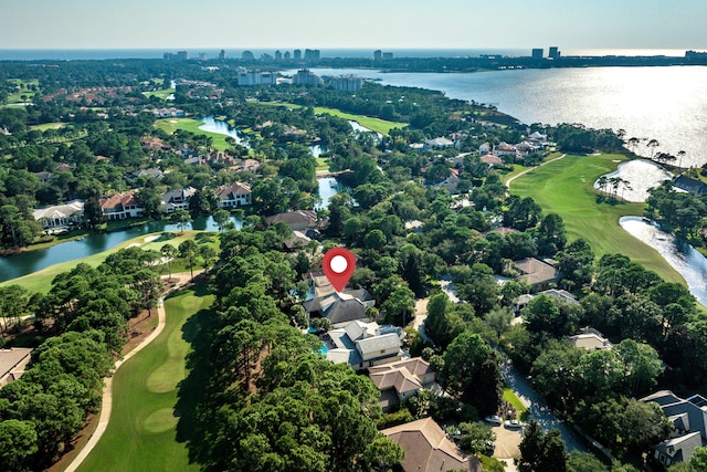 aerial view with a water view and view of golf course