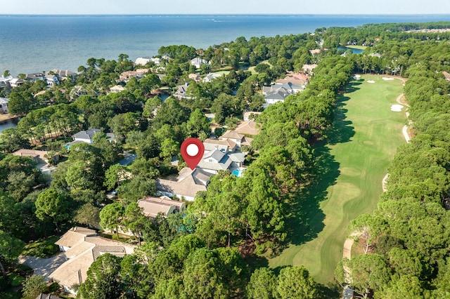 aerial view with a water view and view of golf course