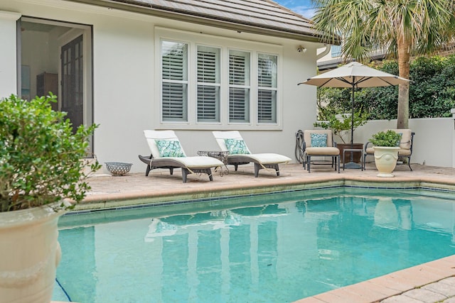 view of pool featuring a patio area and a fenced in pool