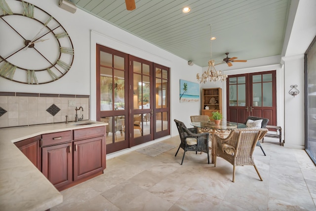 dining space with recessed lighting, french doors, and ceiling fan with notable chandelier