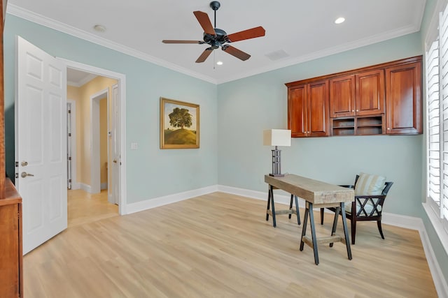 dining area featuring baseboards, light wood-style floors, and crown molding