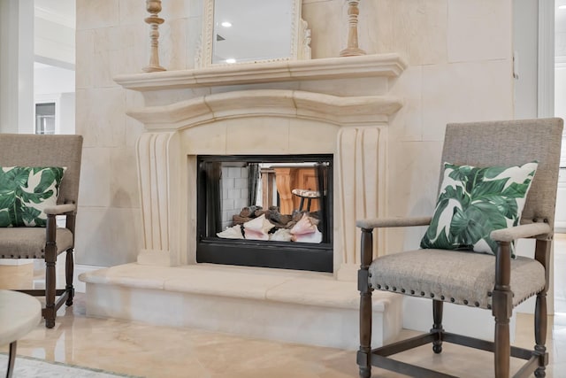 interior space with a fireplace with raised hearth