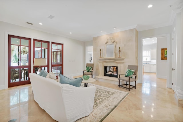 living area featuring visible vents, baseboards, recessed lighting, a fireplace, and marble finish floor