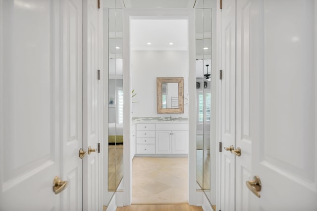 bathroom with recessed lighting, a healthy amount of sunlight, and vanity