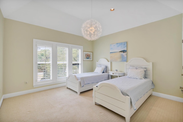 bedroom featuring vaulted ceiling, an inviting chandelier, baseboards, and carpet floors