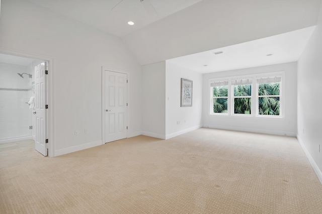 unfurnished room with visible vents, baseboards, lofted ceiling, light carpet, and recessed lighting