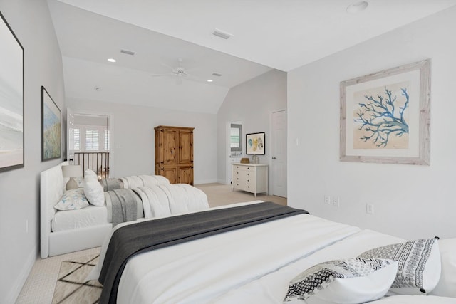 bedroom featuring visible vents, lofted ceiling, light carpet, and ceiling fan