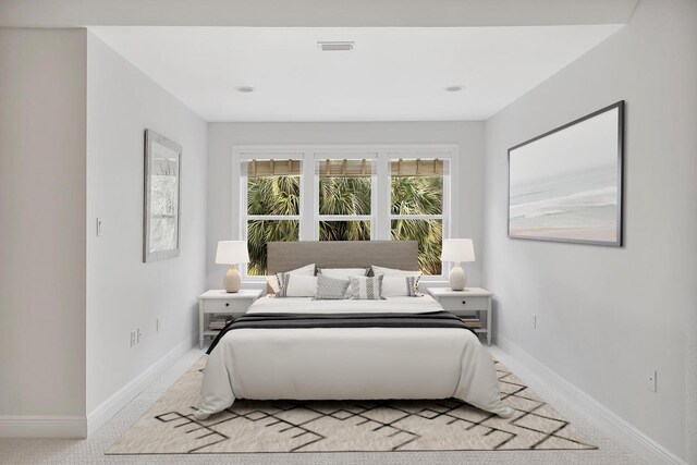 bedroom with visible vents and baseboards