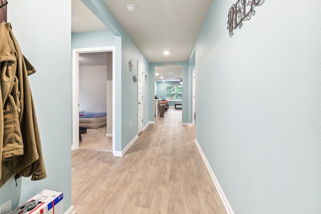 corridor featuring light hardwood / wood-style flooring