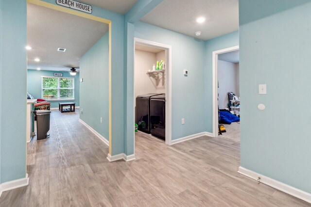 hallway with light hardwood / wood-style floors