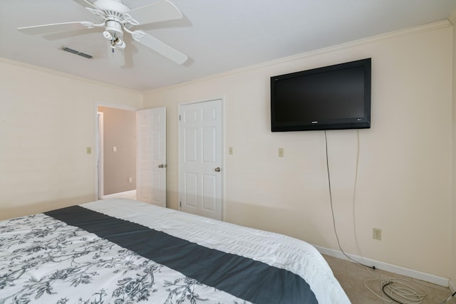 carpeted bedroom featuring ceiling fan and ornamental molding