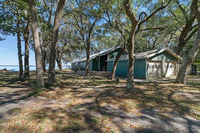 view of side of home featuring a garage