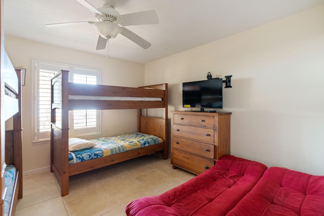 bedroom with light tile patterned floors and ceiling fan