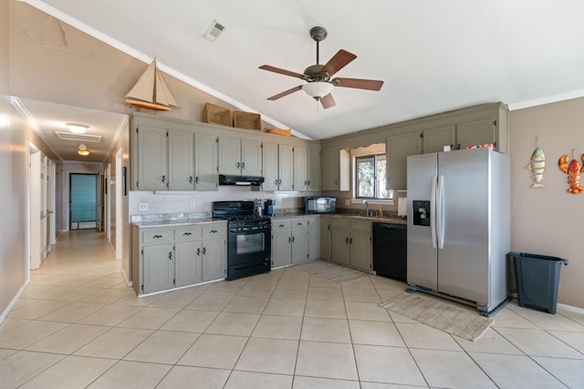 kitchen featuring ceiling fan, sink, lofted ceiling, light tile patterned flooring, and black appliances