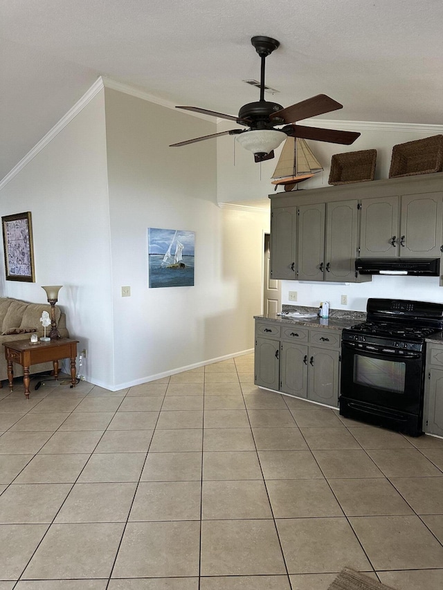 kitchen with gray cabinetry, black gas range, lofted ceiling, and crown molding