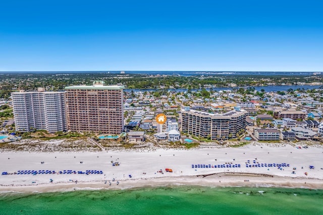 drone / aerial view featuring a water view and a view of the beach