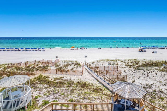 water view with a beach view and a gazebo