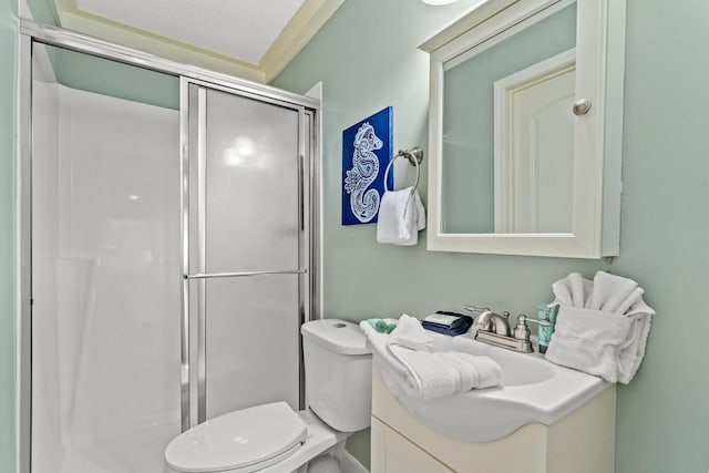 bathroom featuring walk in shower, a textured ceiling, vanity, and toilet