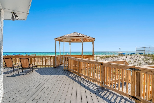 deck featuring a water view and a gazebo