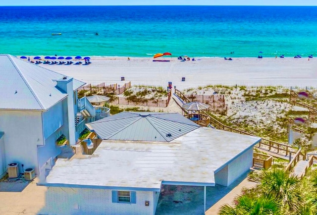 aerial view featuring a water view and a view of the beach