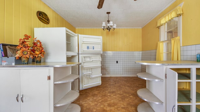 bathroom with a notable chandelier and tile flooring