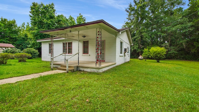 view of front of home with a porch and a front yard