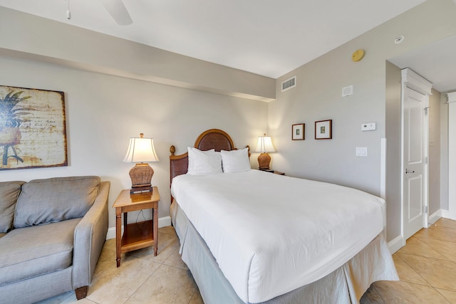 bedroom with ceiling fan and light tile floors