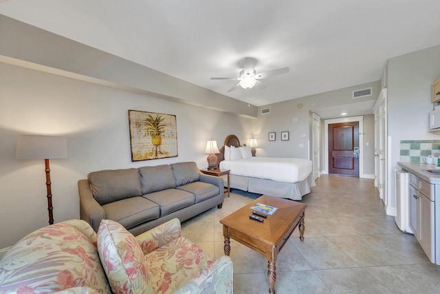 living room with ceiling fan and light tile floors