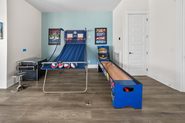 game room featuring dark hardwood / wood-style floors