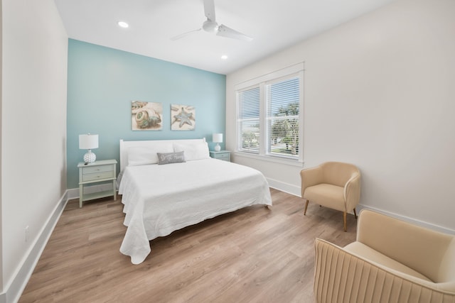 bedroom with wood-type flooring and ceiling fan