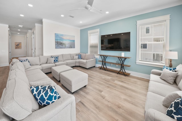 living room with ceiling fan, light hardwood / wood-style floors, and crown molding