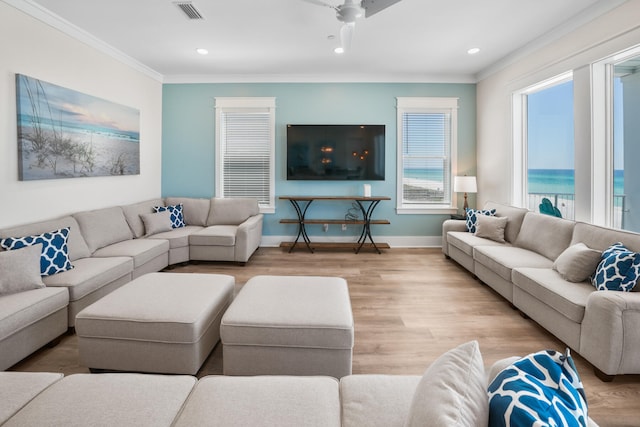 living room featuring a water view, ceiling fan, crown molding, and hardwood / wood-style flooring