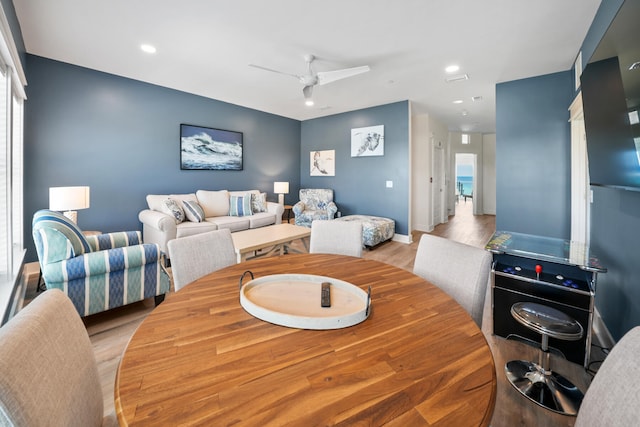 dining area featuring light hardwood / wood-style floors and ceiling fan