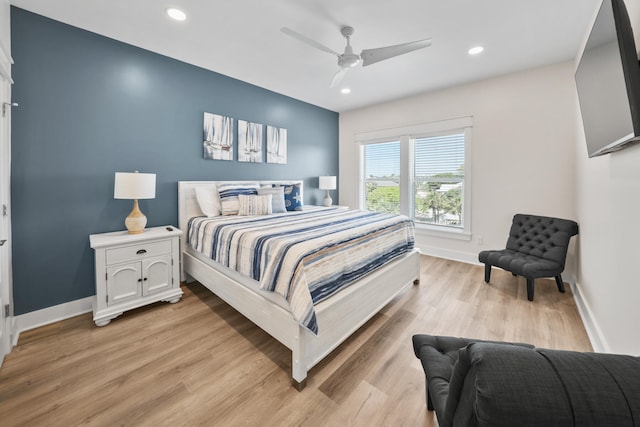 bedroom featuring light hardwood / wood-style floors and ceiling fan