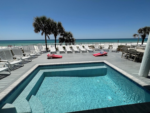 view of pool with a water view