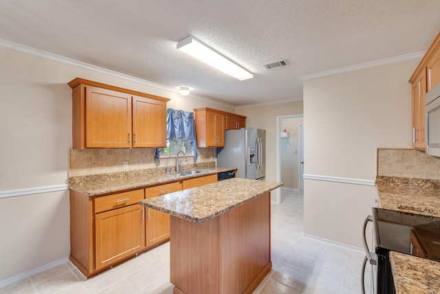 kitchen with light tile flooring, stainless steel appliances, a kitchen island, tasteful backsplash, and a textured ceiling