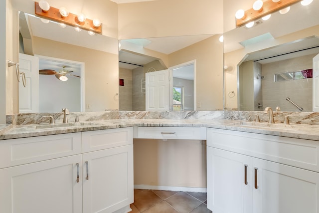 bathroom with double vanity, ceiling fan, and tile floors