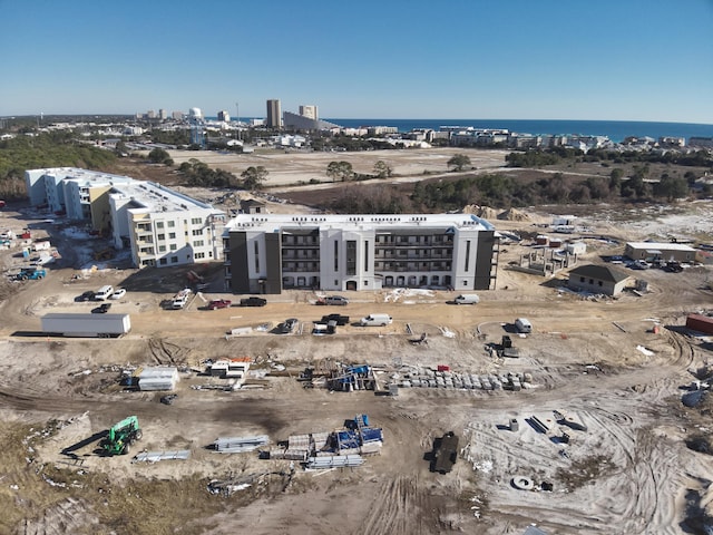 drone / aerial view featuring a water view and a view of city