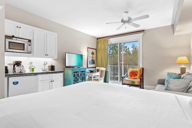 bedroom featuring sink, ceiling fan, and access to exterior