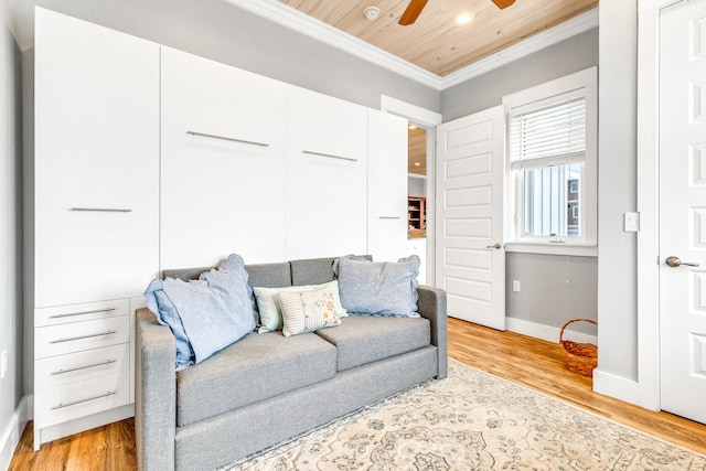 living room featuring light wood-type flooring, ceiling fan, ornamental molding, and wood ceiling