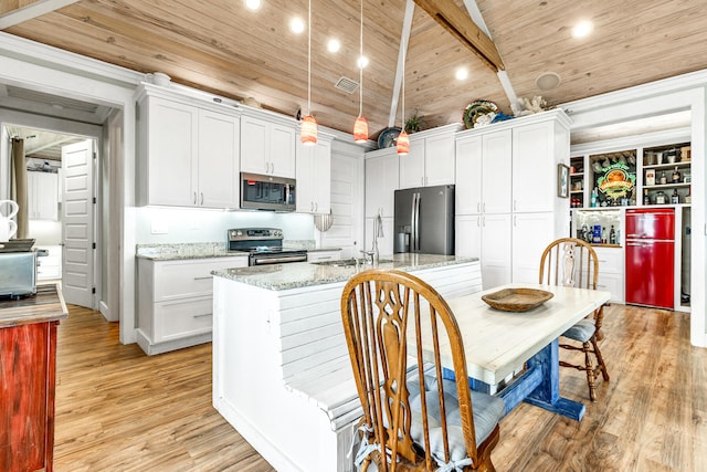 kitchen featuring wooden ceiling, white cabinets, lofted ceiling with beams, light stone counters, and stainless steel appliances