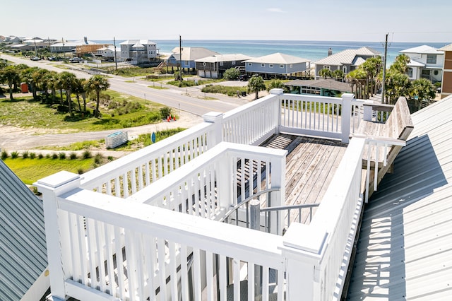 wooden deck featuring a water view